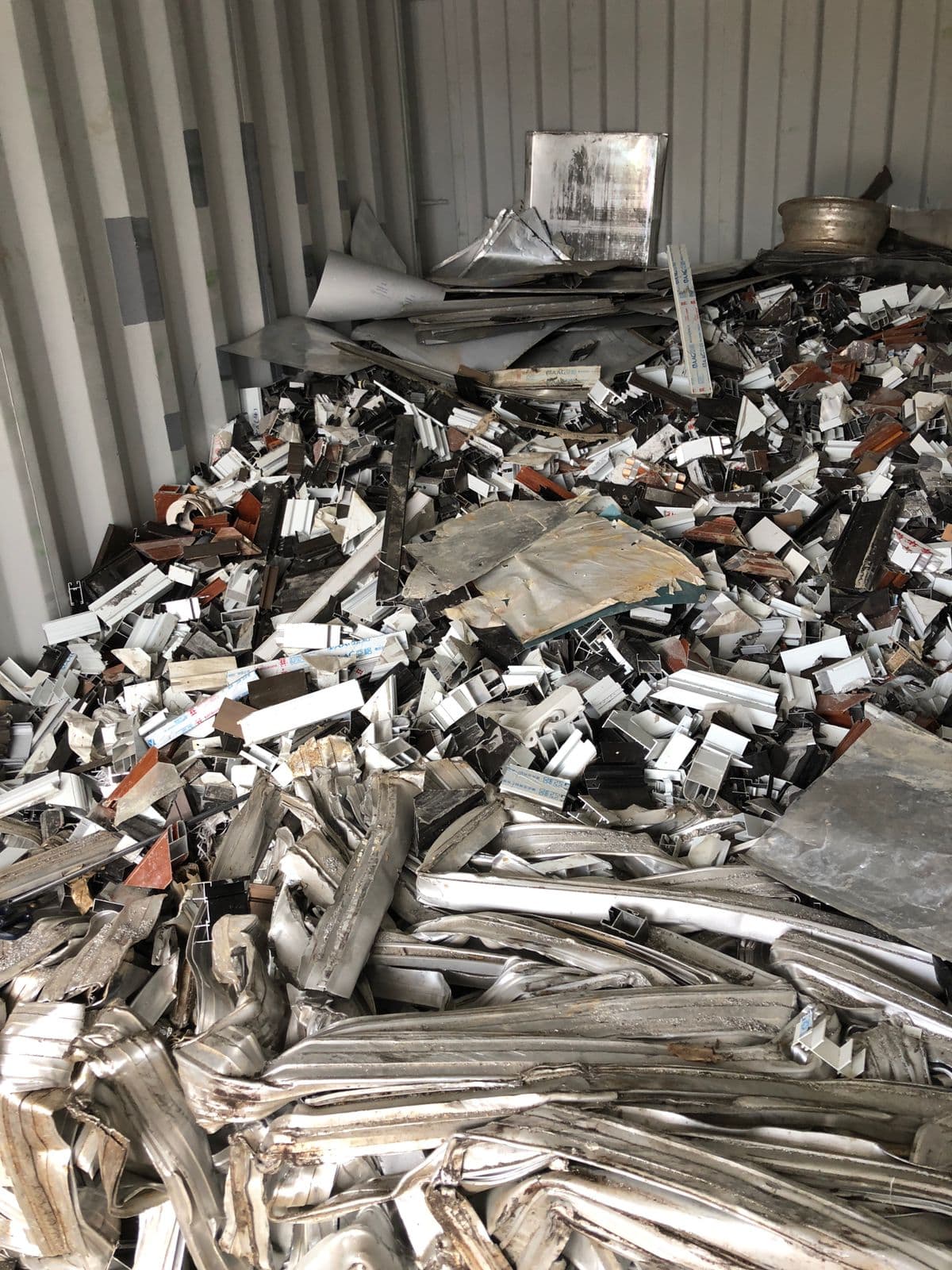 Aluminum scrap in container